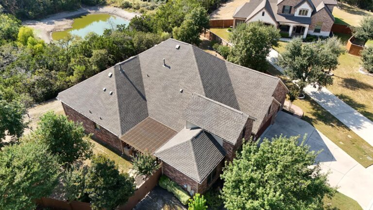 Aerial view of roof replacement in progress on residential home