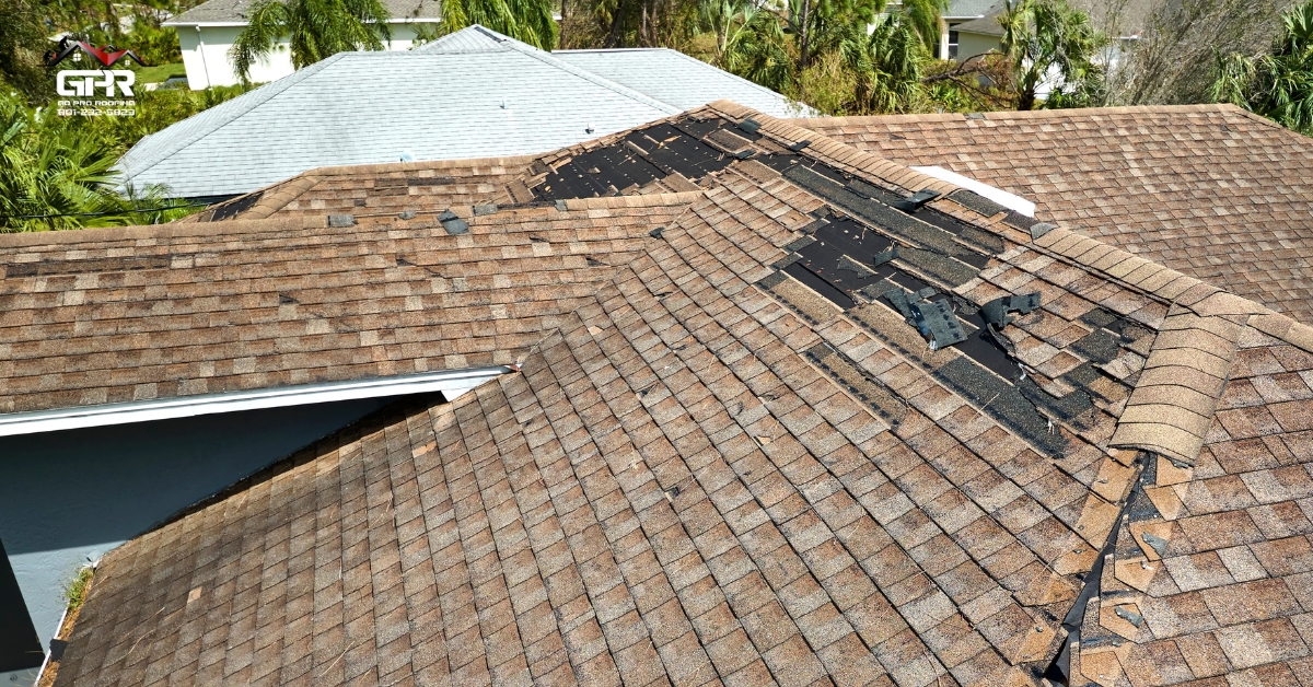 Roof damaged after a storm with missing shingles on a Utah home