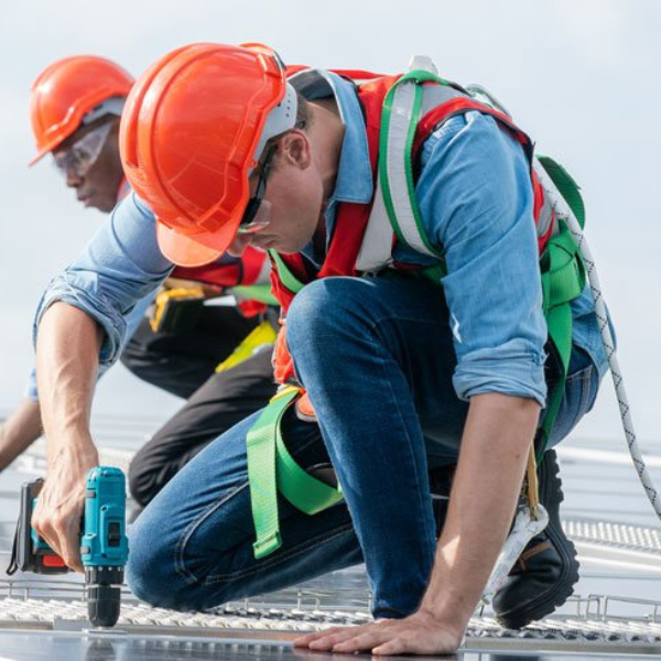 Roofing professional installing new asphalt shingles.