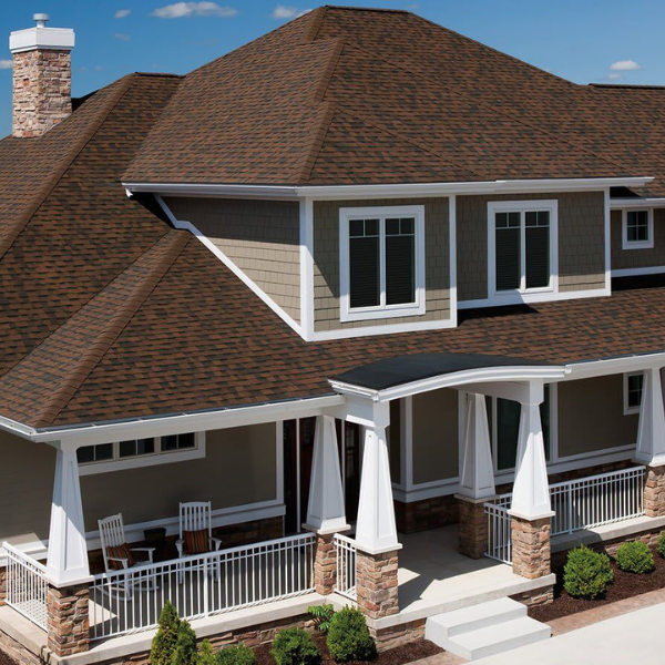 Certified roofer discussing repair options with homeowner