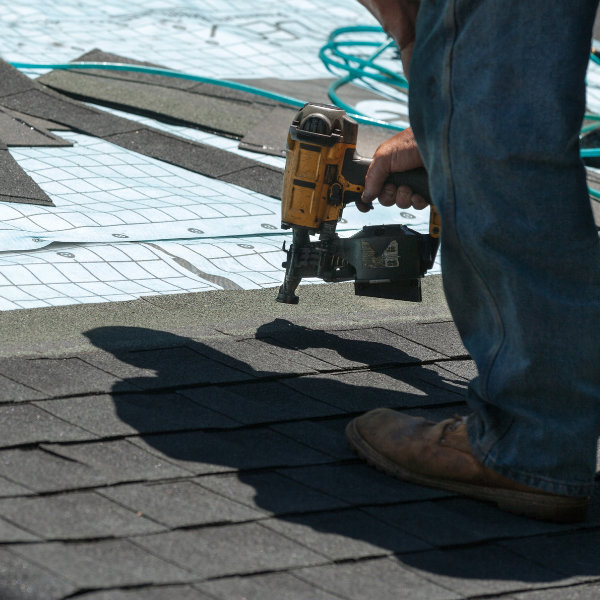 Roofing team working on a commercial flat roof