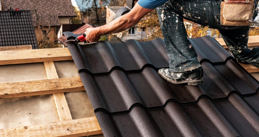 Experienced roofer fixing a roof under cloudy skies